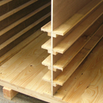 Softwood case partitioned and shelved for car panels